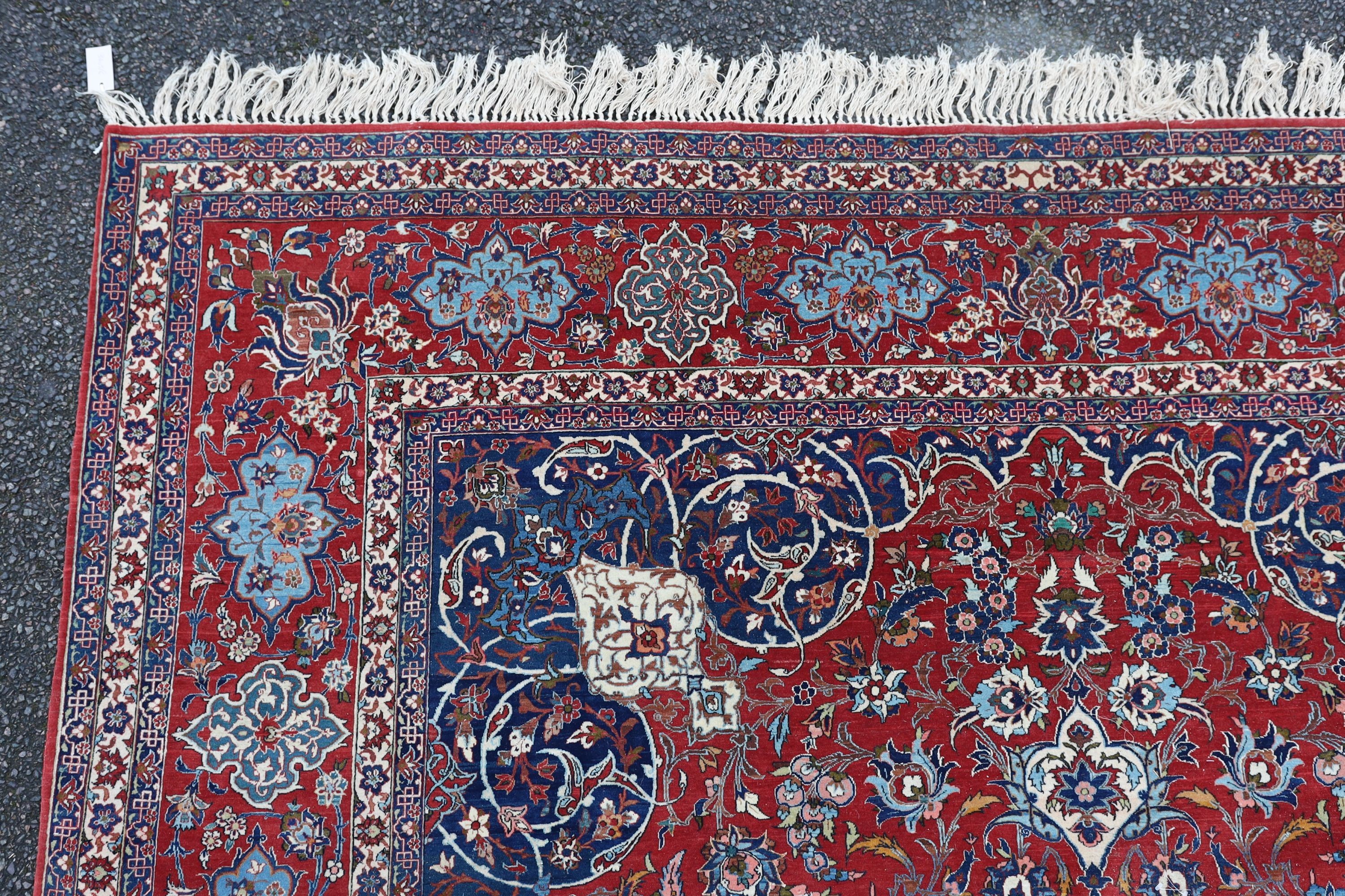 A Isfahan red ground carpet 350 x 260cm.
